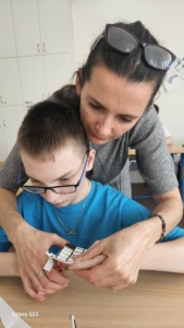 Počítání, plavání a rehabilitace v Pokroku,  práce na PC a psaní dopisu